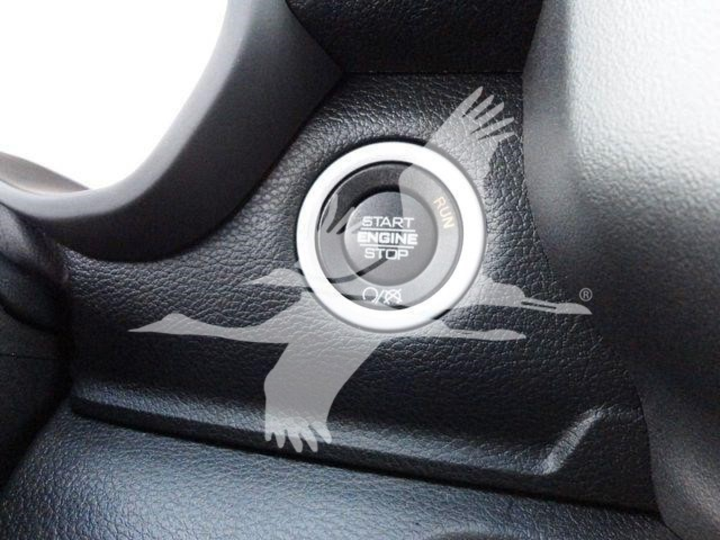 Ram 4500 engine start/stop push button on dashboard with textured black surface