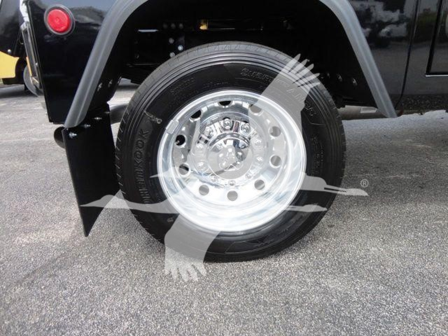 Wheel and tire of a Ram 4500 truck showing chrome alloy wheel and tire tread.