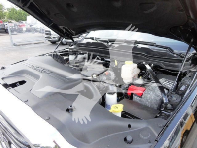 Ram 4500 HD SLT engine bay showing coolant reservoir, brake fluid reservoir, and engine components under open hood.