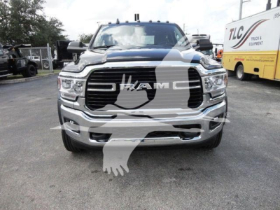 Ram 4500 HD SLT front view showing large grille with RAM emblem, chrome bumper, and headlights; white watermark of an eagle overlayed on image.