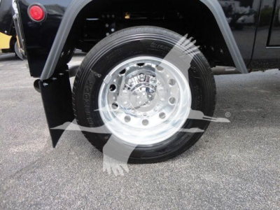 Wheel and tire of a Ram 4500 truck showing chrome alloy wheel and tire tread.