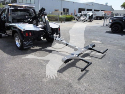 Ram 4500 tow truck with hitch-mounted loading arms in a dealership lot, Winch category, stock J68842.