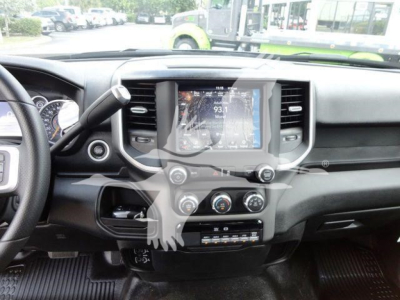 Ram interior photo showing center touchscreen display and climate controls in a 2024 Ram 4500HD SLT dashboard view.