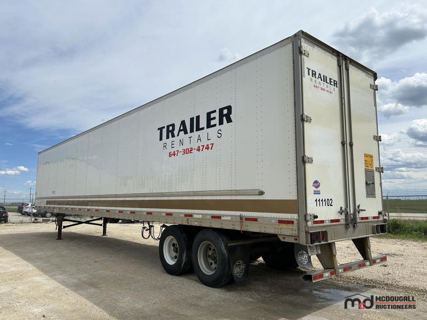 53' dry van trailer with 'TRAILER RENTALS' branding on the side, dual rear axles, white exterior, vendor logo near back, VIN and lot numbers not visible, trailer in an outdoor lot.