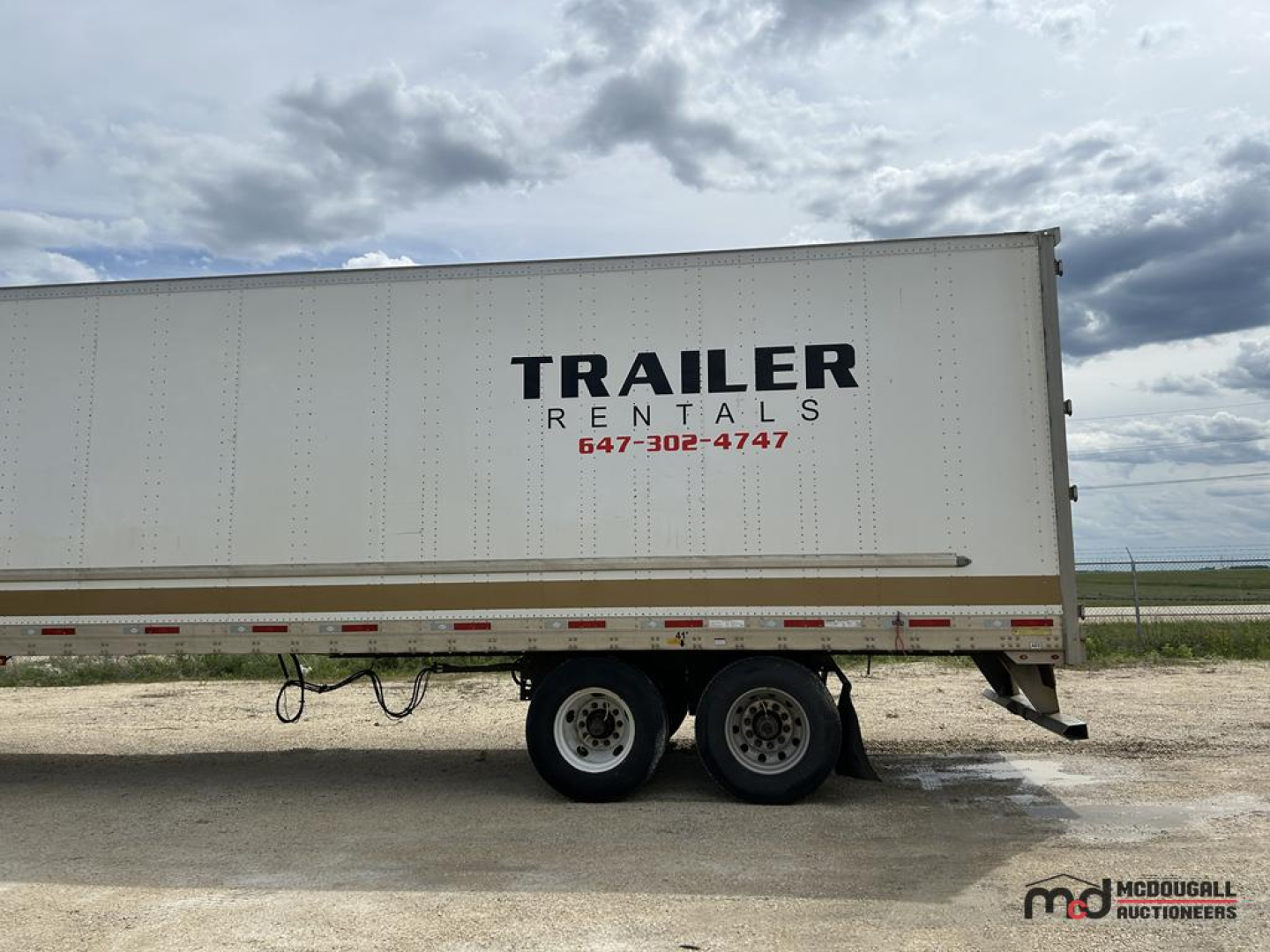 Trailer Rental 53 ft dry van semi-trailer side view showing TRAILER RENTALS text and phone number on white exterior