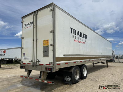 53' dry van trailer showing TRAILER RENTALS branding on side and rear doors, dual rear axles with Mudflaps, VIN plate not visible.