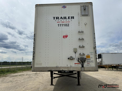 Trailer rear showing white dry van, with metal hinge and license plate area, top center logo, text TRAILER RENTALS, 111102, and service decals.