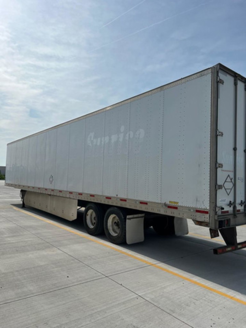 Trailer side view of a used 2011 Utility Van trailer with a light gray painted exterior and tandem axle, stock number U90527, VIN 1UYVS2532BP189504.