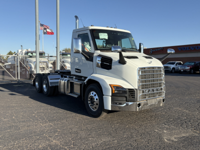 Mack AN64T truck in lot showing front and side view with chrome grille and daytime cab; VIN 1M1A24GY7VM102512 and stock 72344 visible