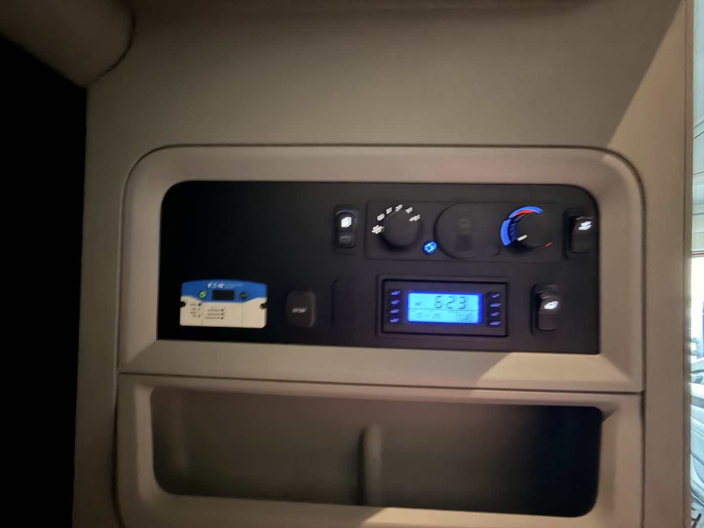 Dashboard of a 2022 Kenworth T680 truck showing control panel, gauges, and digital display with blue backlight.