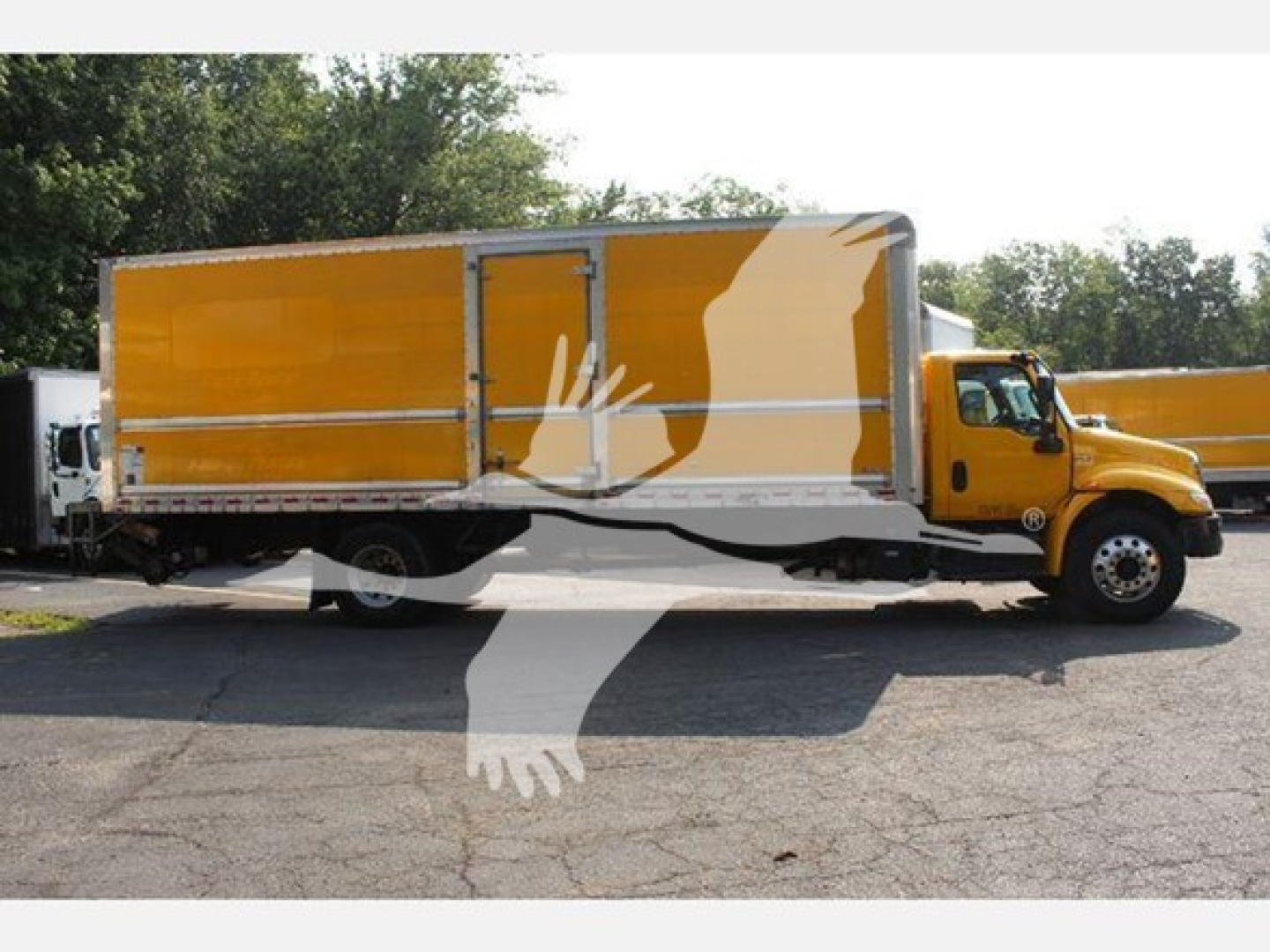 Truck side view showing yellow box truck with cargo bed and cab, International MV model, VIN 3HAEUMML6LL125710, stock T25710.
