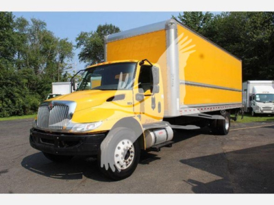Box truck 2020 International MV with yellow cab and large yellow box cargo area, side view showing front grille, cab mirrors, and white wheels.