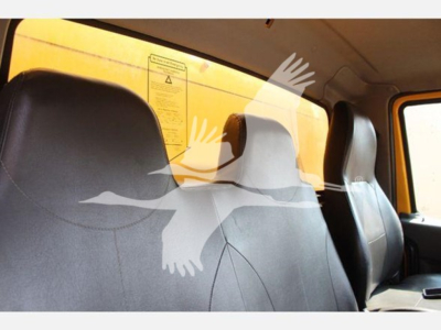 Interior cab view of a 2020 International MV truck showing seats and window.