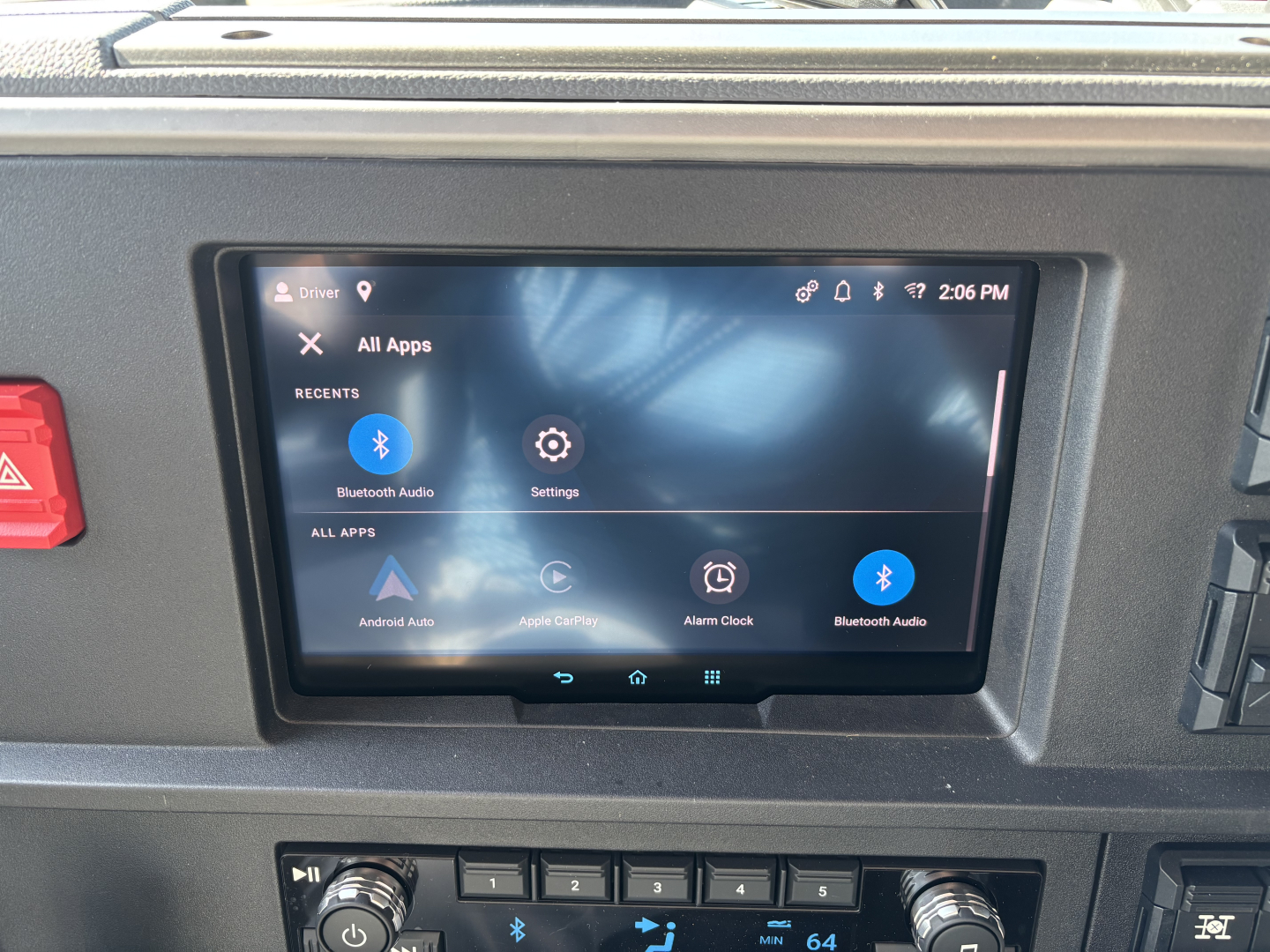 Truck interior dashboard showing an Android Auto/Settings tablet display mounted in center panel.