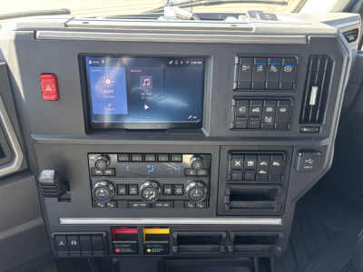 Mack PR64T76H dash and touchscreen display showing vehicle controls and climate panel.