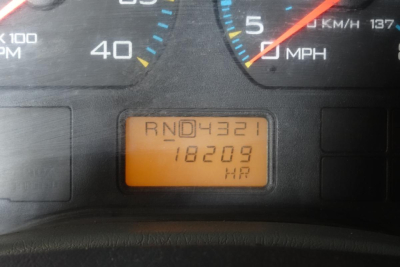 Vehicle instrument cluster and odometer reading showing RND4321 18209 on the display