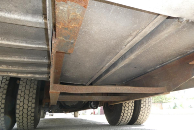 Underbody view of a 2004 International 4300 truck showing undercarriage and dual rear tires.