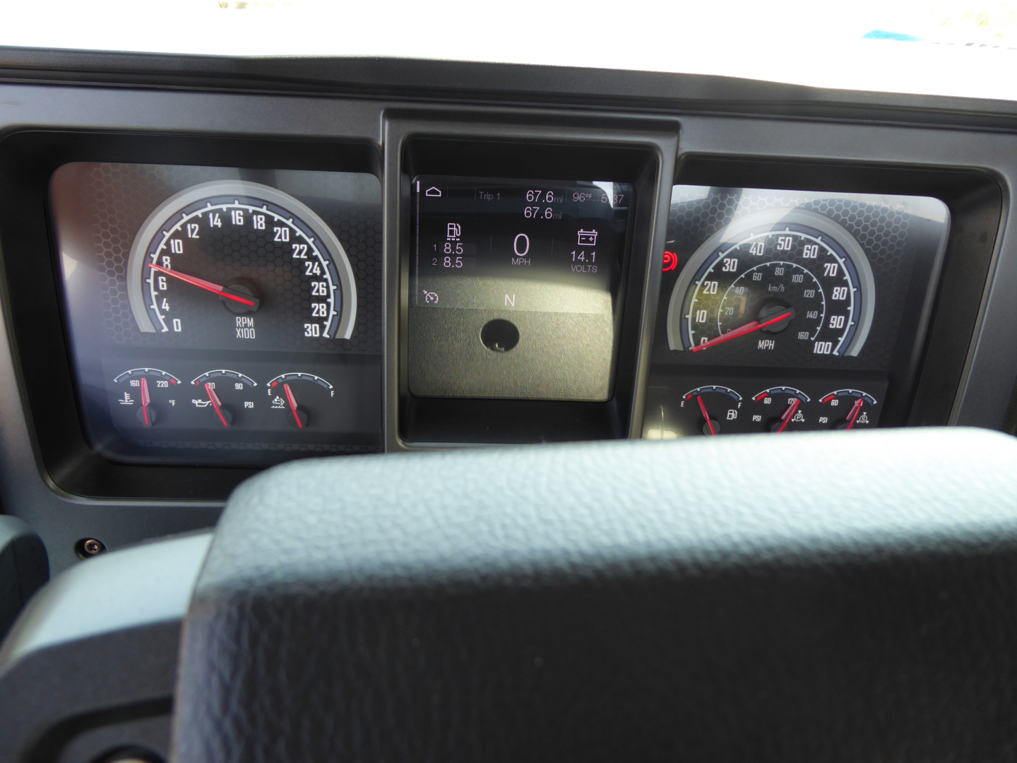 Dashboard of a 2025 Mack MD6 showing instrument gauges, center digital display with 0-0 reading and various icons.