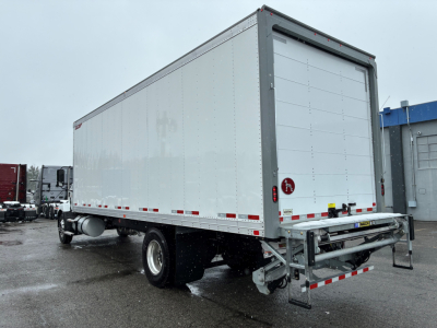 Box truck with rear ramp and grey cargo trailer showing plain white panels and chrome bumper.