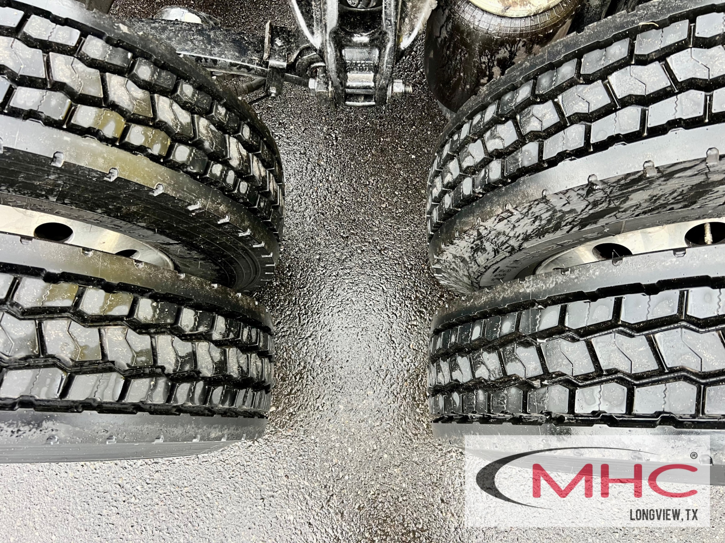 Peterbilt 579 truck dual rear tires view showing tire tread and fifth wheel area.
