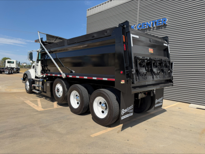 Dump truck, 6x4 Mack GR84F in-service with dump bed, side view showing rear container and hydraulic mechanisms.