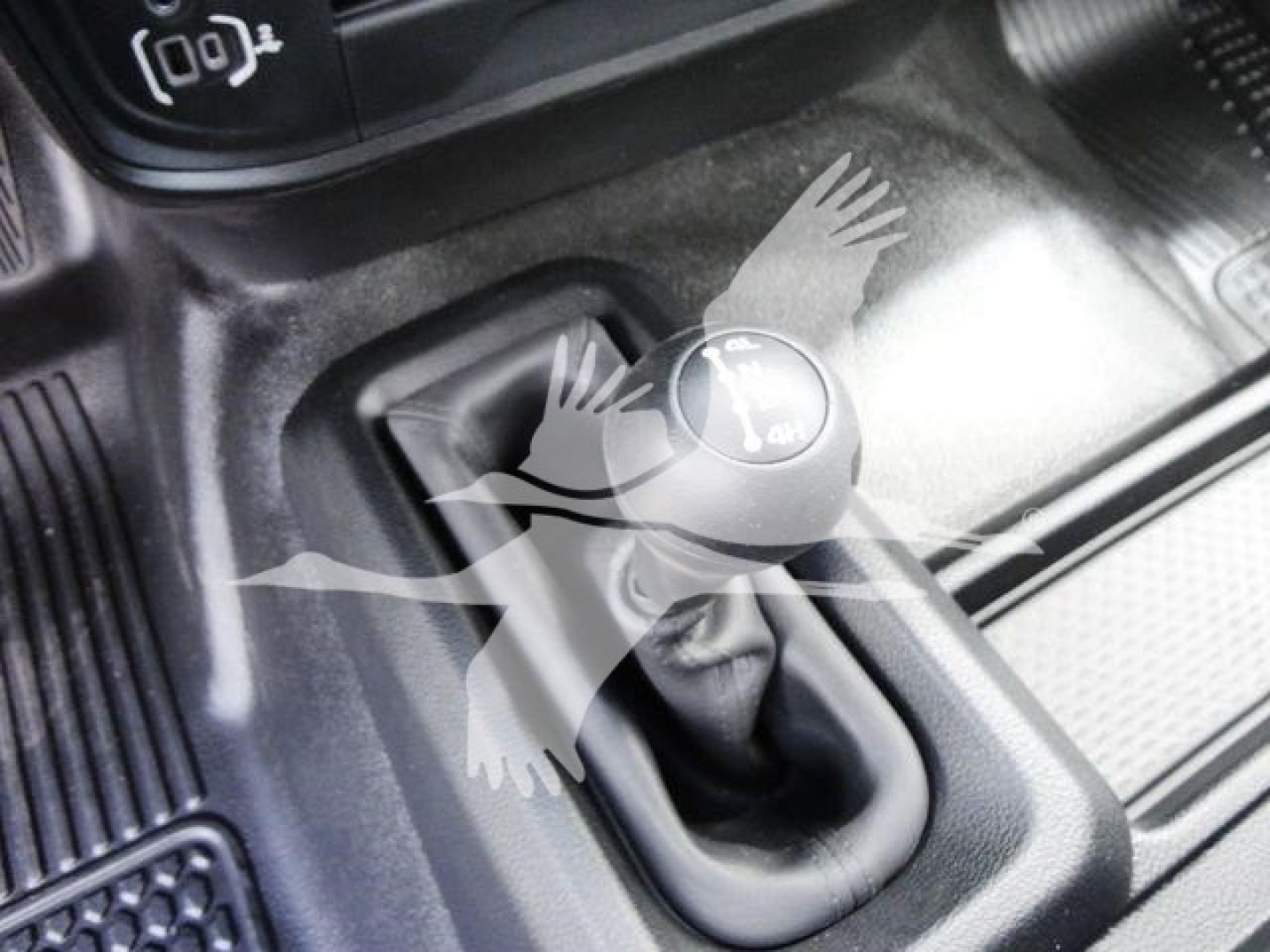 Ram 5500 manual 6-speed gear shifter in cabin showing gear shift boot and surrounding console.