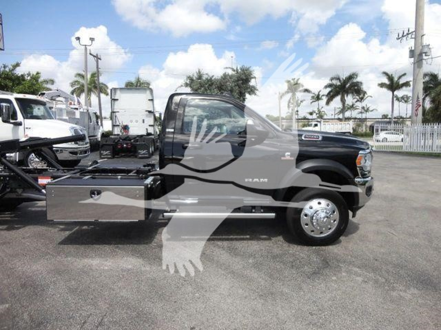 Ram 5500 rollback truck side profile showing storage drawers and fuel/maintenance compartments mounted on chassis.