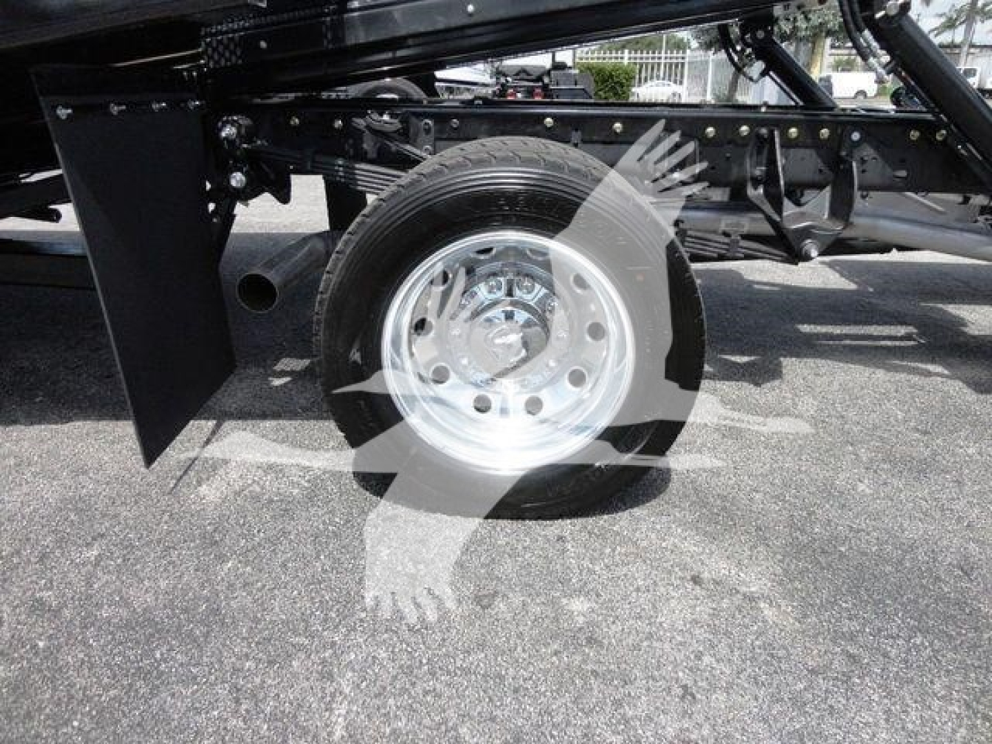 Ram 5500 rollback truck wheel and suspension view showing single rear axle and chrome wheel.