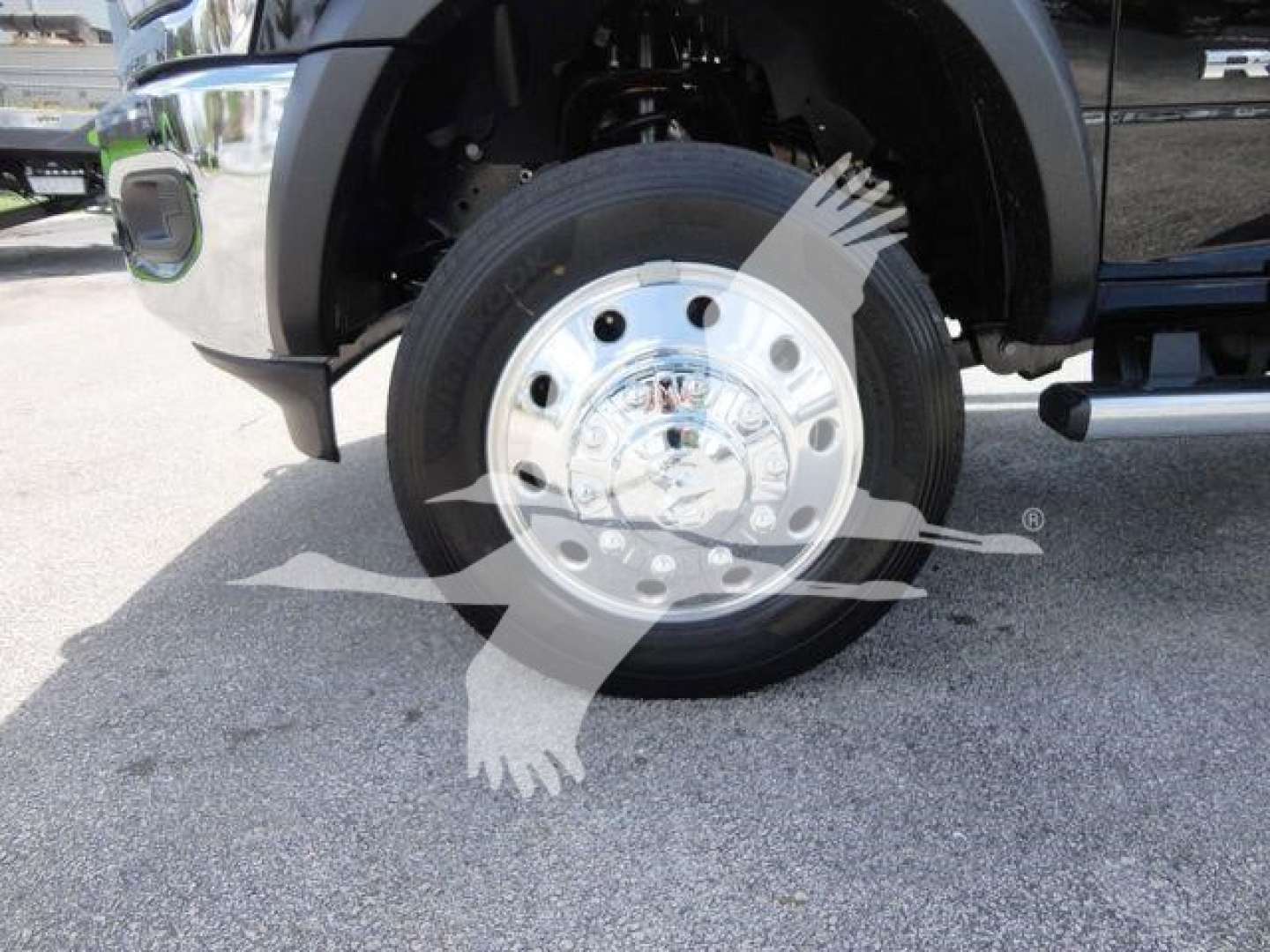 Ram 5500 SLT front wheel and chrome hubcap showing tire and wheel assembly.