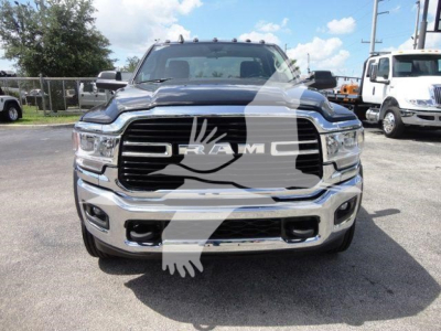 Ram 5500 front view showing grille with RAM badge and chrome bumper, HD truck in silver with black accents.