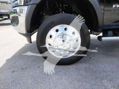 Ram 5500 SLT front wheel and chrome hubcap showing tire and wheel assembly.