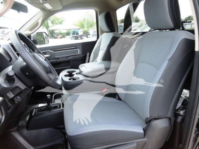 Ram 5500 SLT interior showing front seats and dashboard with center console and cupholders.