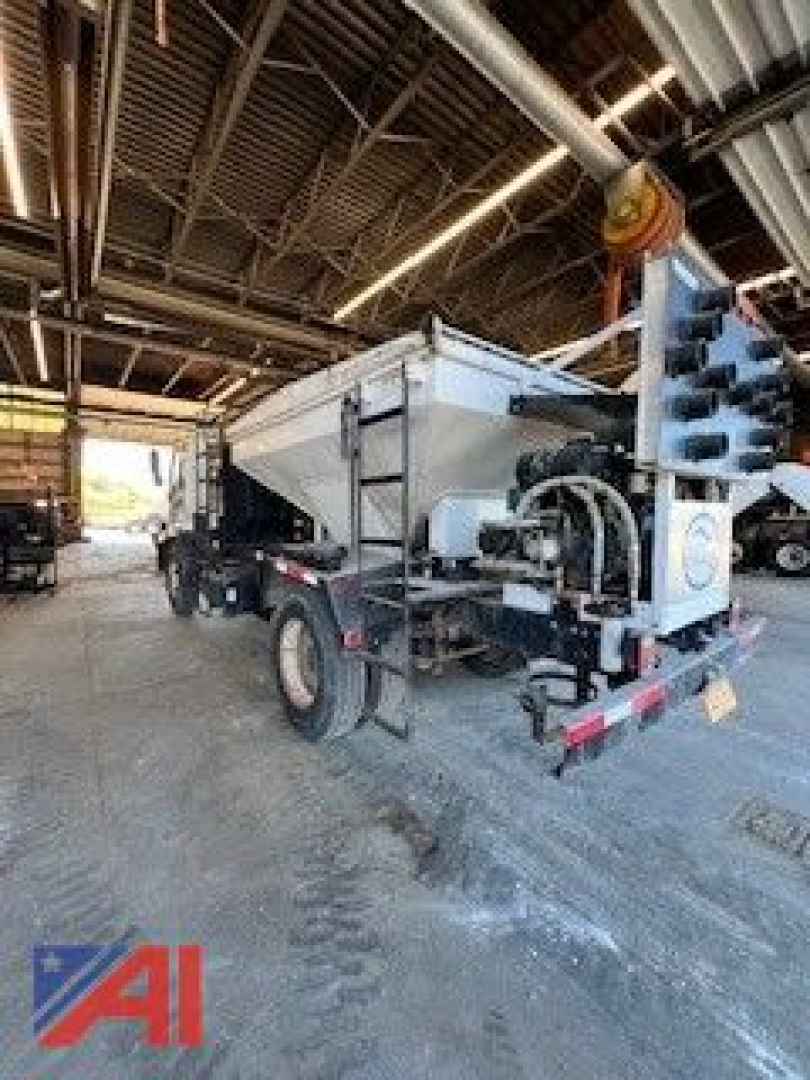 GMC 2009 T7500 pothole patcher truck rear view with hopper and mounting equipment visible