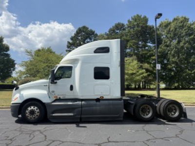 International LT625 semi-truck tractor side view showing sleeper cab and rear axles.