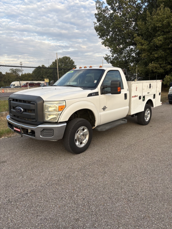 Ford F-250 utility service truck white cab with utility bed, front view at angle.