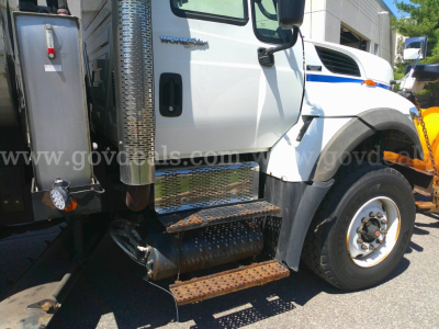 International 7600 truck side view showing rust-free metal steps and chrome exhaust stack