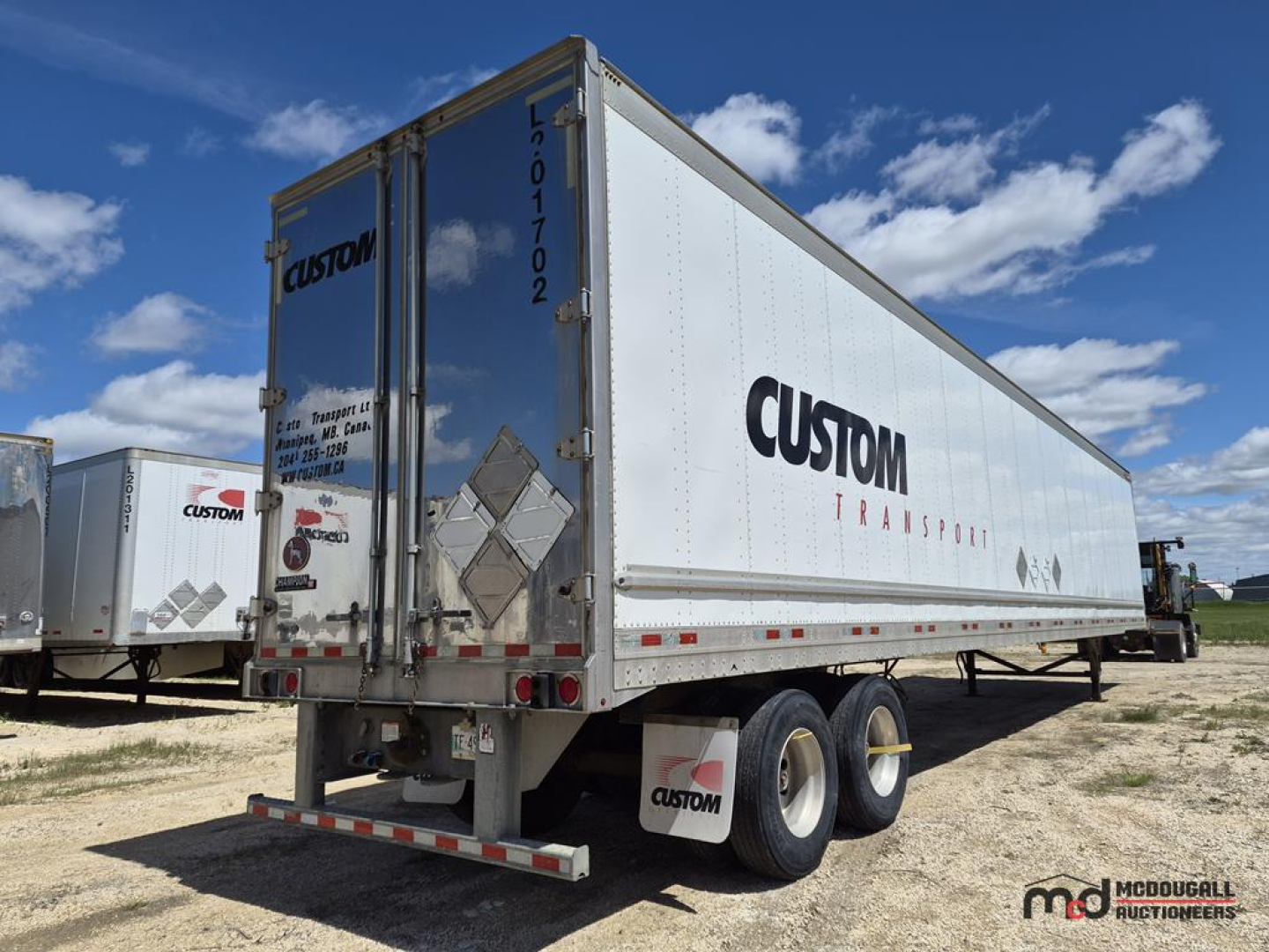 2017 Great Dane 53 feet dry van trailer showing Custom Transport logo on side and rear doors with tandem axles.