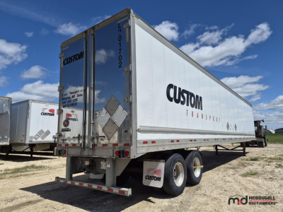 2017 Great Dane 53 feet dry van trailer showing Custom Transport logo on side and rear doors with tandem axles.