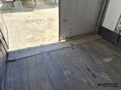 Great Dane 53' dry van trailer interior threshold and floor showing entry from rear with metal diamond-plate sill and worn flooring.