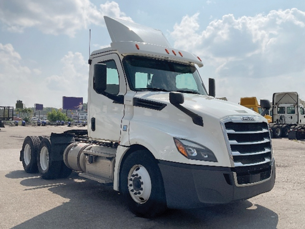 Truck cab and chassis of a 2019 Freightliner Cascadia 126 day cab showing front grille, headlights, and side view; no visible fluid labels.