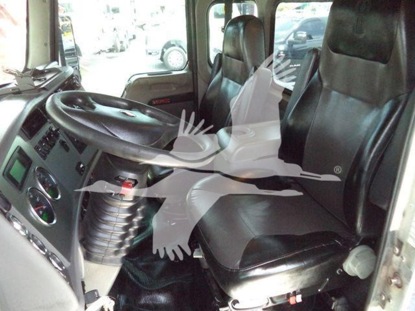 Kenworth T370 cab interior showing driver and passenger seats and dashboard