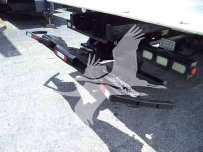Rear view of a 2016 Kenworth T370 rollback truck showing the towing hitch with safety chains and rear bumper assembly.