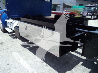 Kenworth T370 rollback truck chassis with a large metal toolbox and frame rails; no visible branding text readable on the toolbox in this view.
