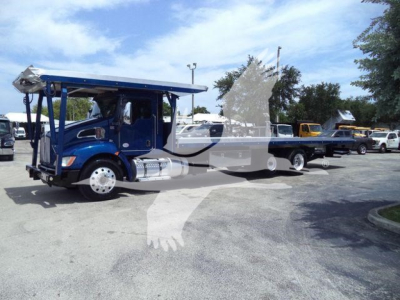Kenworth T370 rollback truck in blue with extended flatbed and crane, side view showing cab and wheels.