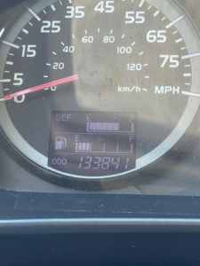Hino 338 dash view showing speedometer up to 75 mph with odometer reading 133,841 miles and fuel gauge indicators.