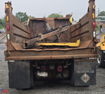 Dump truck bed rear view showing hydraulic mechanism and taillights on a 2005 International WorkStar 7600 dump truck.
