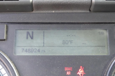 Dashboard display showing transmission gear N, outside temp 80°F, odometer 748,924 miles, brake/air warning light.