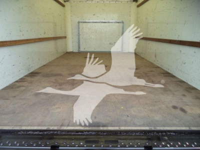 Interior cargo area of a 2022 Ford E350 XL SD truck with empty box; watermark of birds logo overlaying the floor.