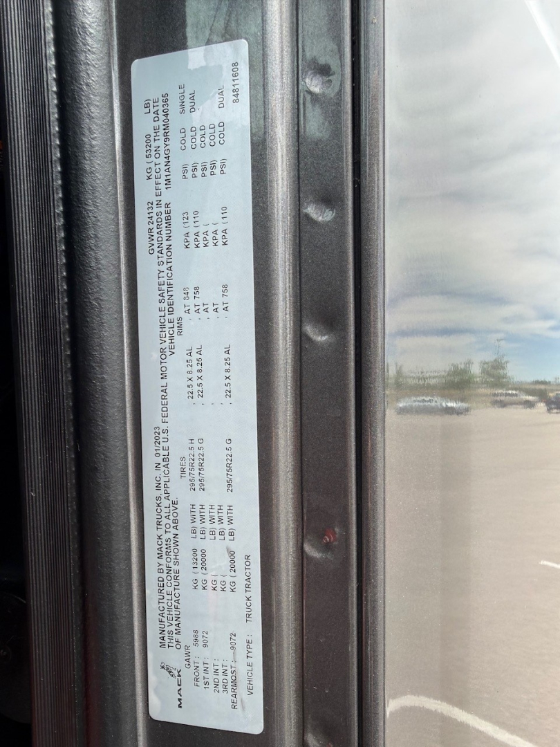 Truck door sticker with detailed specifications and VIN label (MACK ANTHEM). Visible text includes VIN 1M1AN4GY9RM040365 and stock number B3528P along with various weights and engine/axle data.