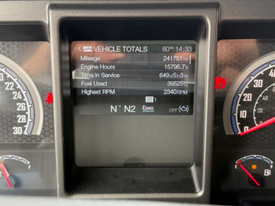 Digital instrument cluster showing vehicle totals: mileage 241,751 mi, engine hours 15,795.7 h, time in service 6495h5m, fuel used 39,525 gal, highest RPM 2340, N N2 on screen.